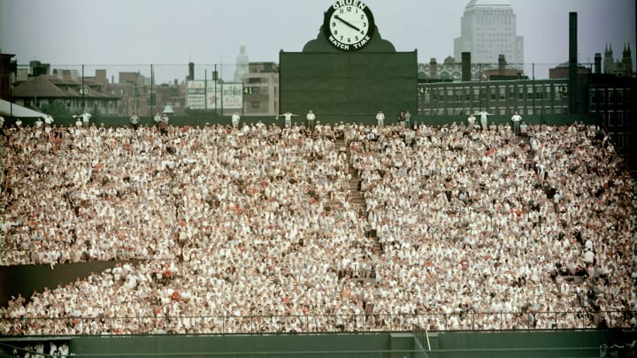 General view of Boston’s Fenway Park, home of the American League baseball team the Boston Red Sox shows the fans packed in the bleachers in the outfield by the Gruen clock, 1960s. Beyond the stadium walls we can see the John Hancock Building at right. (Photo by Hulton Archive/Getty Images)