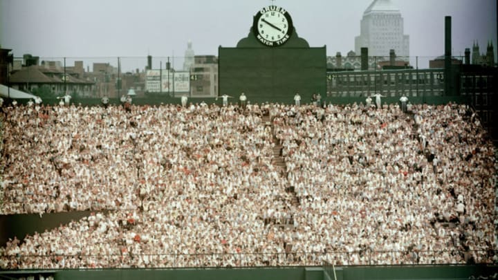 General view of Boston's Fenway Park, home of the American League baseball team the Boston Red Sox shows the fans packed in the bleachers in the outfield by the Gruen clock, 1960s. Beyond the stadium walls we can see the John Hancock Building at right. (Photo by Hulton Archive/Getty Images)