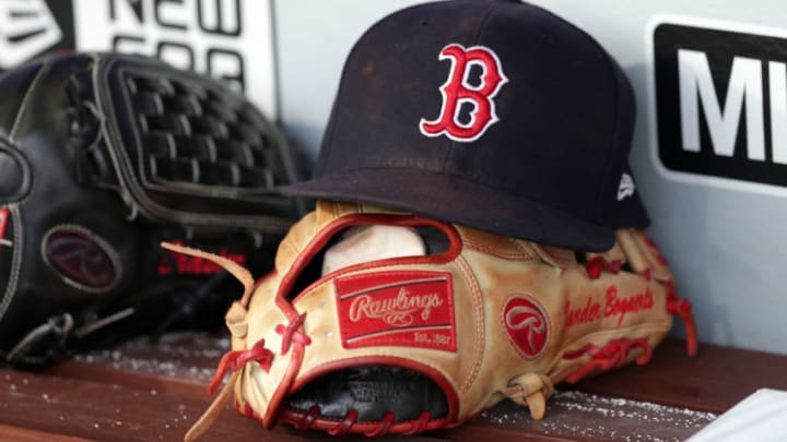 PHILADELPHIA, PA - AUGUST 14: A Rawlings leather baseball glove and a hat sit on the bench in the dugout before a game between the Boston Red Sox and the Philadelphia Phillies at Citizens Bank Park on August 14, 2018 in Philadelphia, Pennsylvania. The Red Sox won 2-1. (Photo by Hunter Martin/Getty Images)