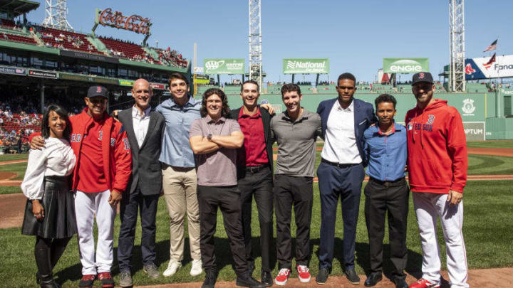 BOSTON, MA - SEPTEMBER 19: Senior Vice President of Major League & Minor League Operations Raquel Ferreira, manager Alex Cora, and Vice President of Player Development of the Boston Red Sox Ben Crockett, and rookies Tristan Casas, Ryan Fitzgerald, Thad Ward, Jarren Duran, Darel Belen, Nixson Munoz, and Trevor Kelley pose for a group photo after being introduced as the 2019 Minor League Awards winners before a game against the San Francisco Giants on September 19, 2019 at Fenway Park in Boston, Massachusetts. (Photo by Billie Weiss/Boston Red Sox/Getty Images)