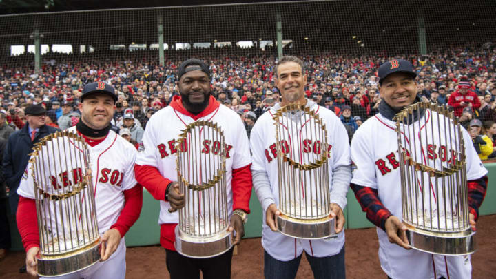 BOSTON, MA - APRIL 9: Steve Pearce #25, former designated hitter David Ortiz, former first baseman Mike Lowell, and former left fielder Manny Ramirez of the Boston Red Sox pose for a photograph with the 2004, 2007, 2013, and 2018 World Series trophies during a 2018 World Series championship ring ceremony before the Opening Day game against the Toronto Blue Jays on April 9, 2019 at Fenway Park in Boston, Massachusetts. All four players won the World Series Most Valuable Player award. (Photo by Billie Weiss/Boston Red Sox/Getty Images)