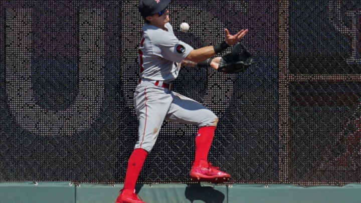 Aug 7, 2022; Kansas City, Missouri, USA; Boston Red Sox center fielder Jarren Duran (40) is unable to make the catch at the wall during the eighth inning against the Kansas City Royals at Kauffman Stadium. Mandatory Credit: Jay Biggerstaff-USA TODAY Sports