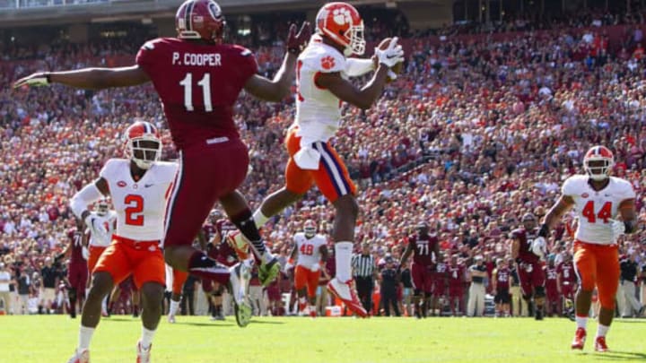 Nov 28, 2015; Columbia, SC, USA; Clemson Tigers cornerback Adrian Baker (21) intercepts the pass intended for South Carolina Gamecocks wide receiver Pharoh Cooper (11) during the first half at Williams-Brice Stadium. Mandatory Credit: Joshua S. Kelly-USA TODAY Sports
