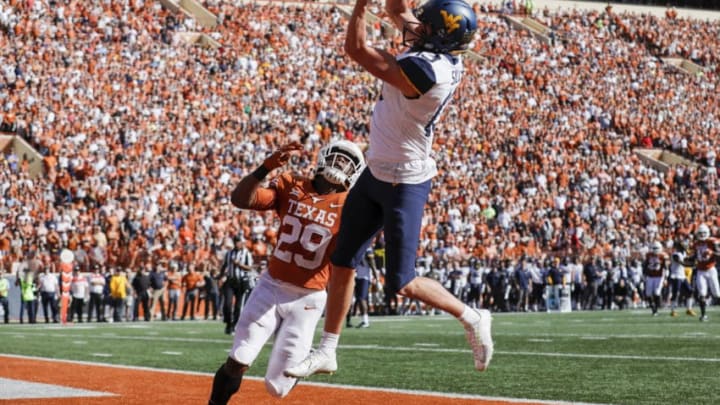 AUSTIN, TX - NOVEMBER 03: David Sills V #13 of the West Virginia Mountaineers catches a pass for a touchdown defended by Josh Thompson #29 of the Texas Longhorns in the second quarter at Darrell K Royal-Texas Memorial Stadium on November 3, 2018 in Austin, Texas. (Photo by Tim Warner/Getty Images)