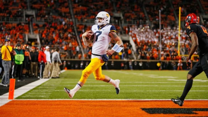 STILLWATER, OK - NOVEMBER 17: Quarterback Will Grier #7 of the West Virginia Mountaineers scores a touchdown untouched against the Oklahoma State Cowboys in the fourth quarter on November 17, 2018 at Boone Pickens Stadium in Stillwater, Oklahoma. Oklahoma State upset West Virginia 45-41. (Photo by Brian Bahr/Getty Images)