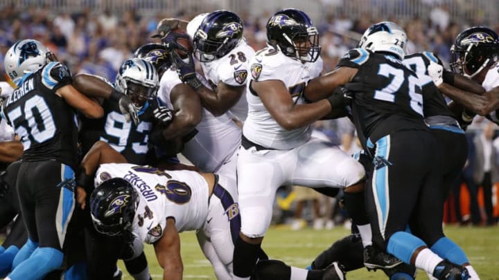 BALTIMORE, MD - AUGUST 11: Terrance West #28 of the Baltimore Ravens dives into the end zone for a one-yard touchdown in the second quarter of a preseason NFL game against the Carolina Panthers at M&T Bank Stadium on August 11, 2016 in Baltimore, Maryland. (Photo by Joe Robbins/Getty Images)