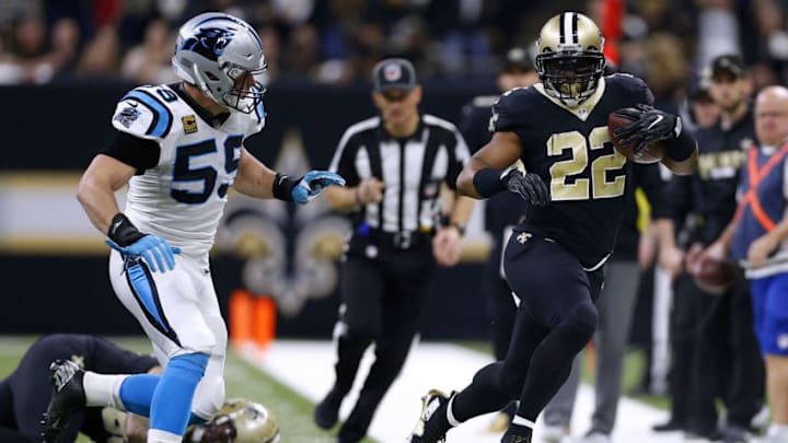 NEW ORLEANS, LA - JANUARY 07: Mark Ingram #22 of the New Orleans Saints runs with the ball as Luke Kuechly #59 of the Carolina Panthers defends during the first half of the NFC Wild Card playoff game at the Mercedes-Benz Superdome on January 7, 2018 in New Orleans, Louisiana. (Photo by Jonathan Bachman/Getty Images)