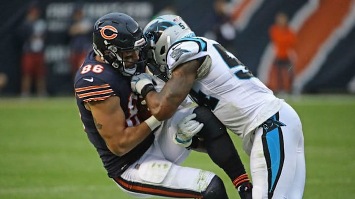 CHICAGO, IL - OCTOBER 22: Zach Miller #86 of the Chicago Bears is hit after a catch by Shaq Green-Thompson #54 and James Bradberry #24 of the Carolina Panthers at Soldier Field on October 22, 2017 in Chicago, Illinois. The Bears defeated the Panthers 17-3. (Photo by Jonathan Daniel/Getty Images)
