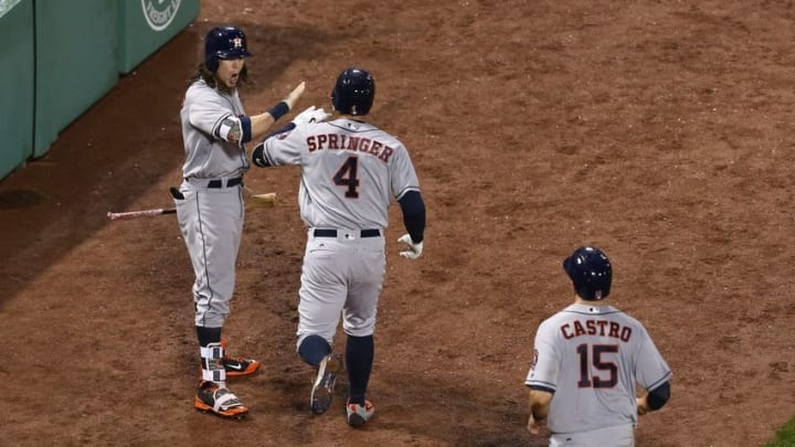 May 13, 2016; Boston, MA, USA; Houston Astros right fielder George Springer (4) celebrates his home run against the Boston Red Sox with left fielder Colby Rasmus (left) and catcher Jason Castro (15) during the sixth inning at Fenway Park. Mandatory Credit: Mark L. Baer-USA TODAY Sports