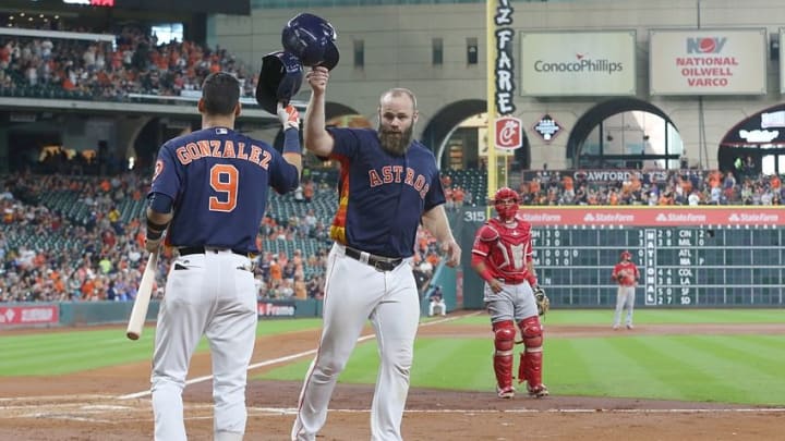 Sep 25, 2016; Houston, TX, USA; Houston Astros first baseman Marwin Gonzalez (9) congratulates catcher Evan Gattis (11) after hitting a home run against the Los Angeles Angels in the second inning at Minute Maid Park. Mandatory Credit: Thomas B. Shea-USA TODAY Sports