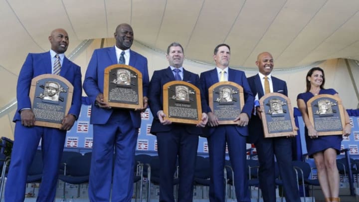 COOPERSTOWN, NEW YORK - JULY 21: Inductees (from left) Harold Baines, Lee Smith, Edgar Martinez, Mike Mussina, Mariano Rivera and Brandy Halladay, wife the late Roy Halladay, pose with their plaques during the Baseball Hall of Fame induction ceremony at Clark Sports Center on July 21, 2019 in Cooperstown, New York. (Photo by Jim McIsaac/Getty Images)
