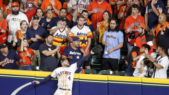 HOUSTON, TX – OCTOBER 19: George Springer #4 of the Houston Astros attempts to catch a home run by DJ LeMahieu #26 of the New York Yankees in the ninth inning during Game Six of the League Championship Series at Minute Maid Park on October 19, 2019 in Houston, Texas. (Photo by Tim Warner/Getty Images)