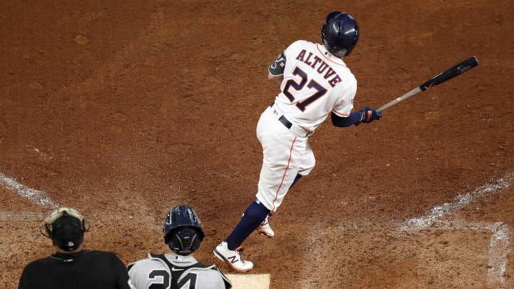 HOUSTON, TX – OCTOBER 19: Jose Altuve #27 of the Houston Astros hits a walk-off home run in the ninth inning against the New York Yankees during Game Six of the League Championship Series at Minute Maid Park on October 19, 2019 in Houston, Texas. (Photo by Tim Warner/Getty Images)