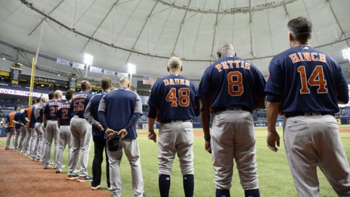 ST. PETERSBURG, FL - AUGUST 29: Houston Astros stand for the National Anthem before their game against the Texas Rangers at Tropicana Field on August 29, 2017 in St. Petersburg, Florida. (Photo by Jason Behnken / Getty Images)