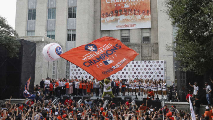 HOUSTON, TX - NOVEMBER 03: Houston Astros mascot Orbit waves a flag during the Houston Astros Victory Parade on November 3, 2017 in Houston, Texas. The Astros defeated the Los Angeles Dodgers 5-1 in Game 7 to win the 2017 World Series. (Photo by Tim Warner/Getty Images)