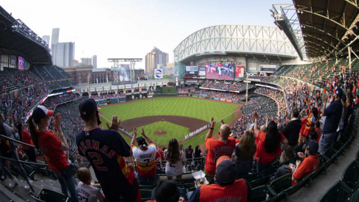 HOUSTON, TEXAS - APRIL 08: Fans stand as players take the field prior to the game between the Houston Astros and the Oakland Athletics at Minute Maid Park on April 08, 2021 in Houston, Texas. (Photo by Carmen Mandato/Getty Images)