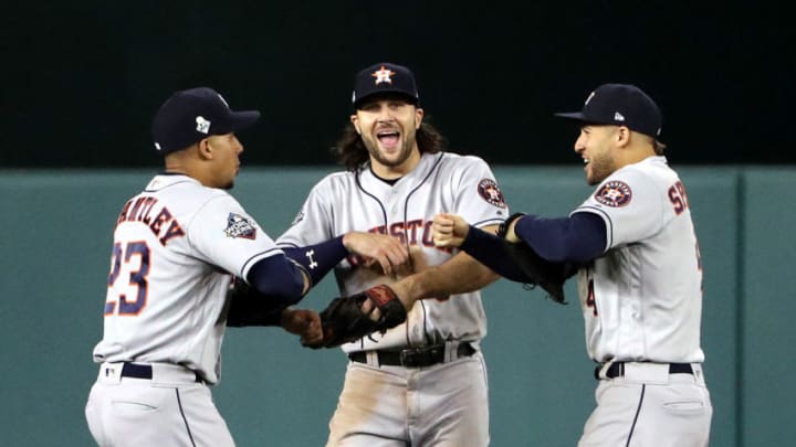 WASHINGTON, DC - OCTOBER 26: Michael Brantley #23, Jake Marisnick #6 and George Springer #4 of the Houston Astros celebrate their teams 8-1 win against the Washington Nationals in Game Four of the 2019 World Series at Nationals Park on October 26, 2019 in Washington, DC. (Photo by Patrick Smith/Getty Images)