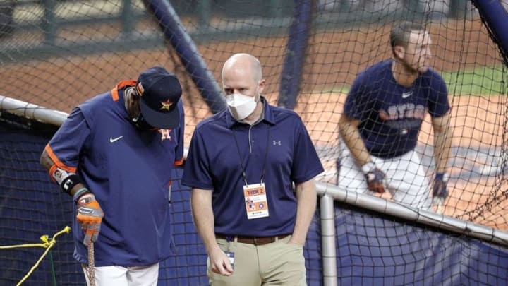 James Click talks with manager Dusty Baker #12 of the Houston Astros during batting practice before a game against the Los Angeles Dodgers at Minute Maid Park on July 29, 2020 in Houston, Texas. (Photo by Bob Levey/Getty Images)