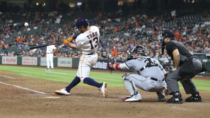 Jun 17, 2021; Houston, Texas, USA; Houston Astros third baseman Abraham Toro (13) hits a two-run home run against the Chicago White Sox in the seventh inning at Minute Maid Park. Mandatory Credit: Thomas Shea-USA TODAY Sports