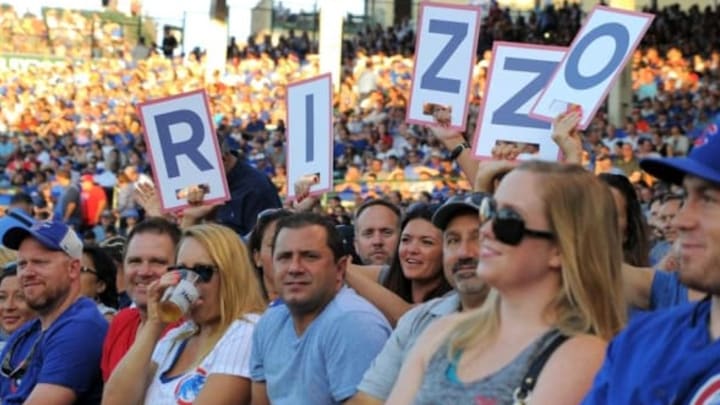 Aug 1, 2016; Chicago, IL, USA; Fans hold up signs for Chicago Cubs first baseman Anthony Rizzo (not pictured) while at bat during the first inning against the Miami Marlins at Wrigley Field. Mandatory Credit: Patrick Gorski-USA TODAY Sports