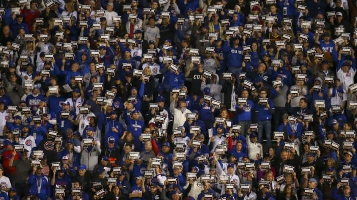 Oct 29, 2016; Chicago, IL, USA; Fans hold up "Stand up to cancer" signs during the fifth inning in game four of the 2016 World Series between the Chicago Cubs and the Cleveland Indians at Wrigley Field. Mandatory Credit: Jerry Lai-USA TODAY Sports