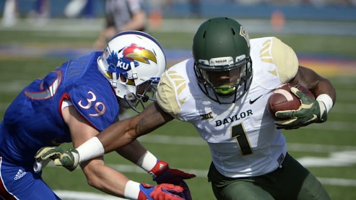 Oct 10, 2015; Lawrence, KS, USA; Baylor Bears wide receiver Corey Coleman (1) scores a touchdown against Kansas Jayhawks safety Michael Glatczak (39) in the first half at Memorial Stadium. Mandatory Credit: John Rieger-USA TODAY Sports