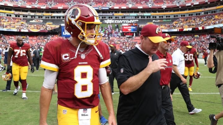 Sep 18, 2016; Landover, MD, USA; Washington Redskins quarterback Kirk Cousins (8) and Redskins head coach Jay Gruden (R) walk off the field after their game against the Dallas Cowboys at FedEx Field. The Cowboys won 27-23. Mandatory Credit: Geoff Burke-USA TODAY Sports