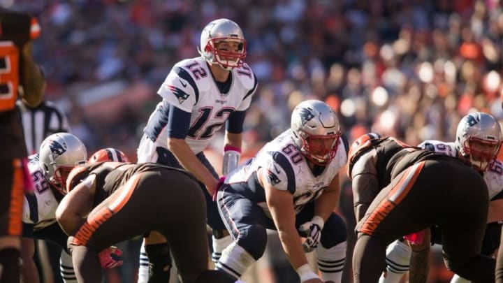 Oct 9, 2016; Cleveland, OH, USA; New England Patriots quarterback Tom Brady (12) and center David Andrews (60) against the Cleveland Browns during the fourth quarter at FirstEnergy Stadium. The Patriots won 33-13. Mandatory Credit: Scott R. Galvin-USA TODAY Sports