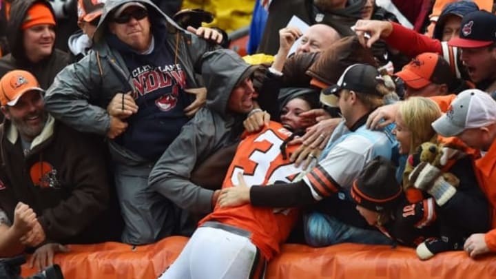 Oct 30, 2016; Cleveland, OH, USA; Cleveland Browns running back Isaiah Crowell (34) jumps into the Dawg Pound after scoring a touchdown during the second quarter against the New York Jets at FirstEnergy Stadium. Mandatory Credit: Ken Blaze-USA TODAY Sports