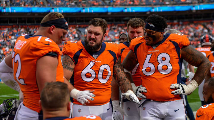 DENVER, CO – SEPTEMBER 15: Connor McGovern #60 of the Denver Broncos talks to teammates on the offensive line, including Garett Bolles #72, Elijah Wilkinson #68, and Dalton Risner #66 as they sit in the bench area during a game against the Chicago Bears at Empower Field at Mile High on September 15, 2019 in Denver, Colorado. (Photo by Dustin Bradford/Getty Images)