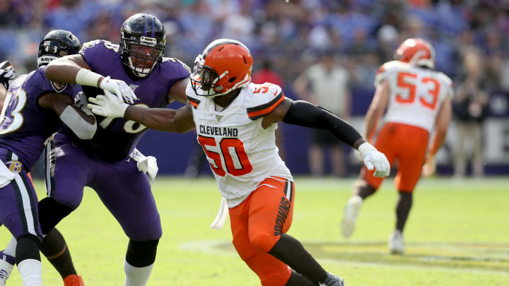 BALTIMORE, MARYLAND – SEPTEMBER 29: Orlando Brown #78 of the Baltimore Ravens blocks Chris Smith #50 of the Cleveland Browns at M&T Bank Stadium on September 29, 2019 in Baltimore, Maryland. (Photo by Rob Carr/Getty Images)
