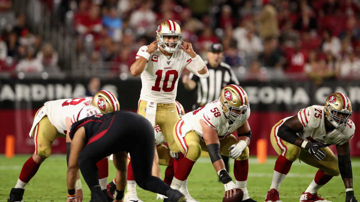 GLENDALE, ARIZONA – OCTOBER 31: Quarterback Jimmy Garoppolo #10 of the San Francisco 49ers prepares to snap the football against the Arizona Cardinals during the second half of the NFL game at State Farm Stadium on October 31, 2019 in Glendale, Arizona. The 49ers defeated the Cardinals 28-25. (Photo by Christian Petersen/Getty Images)