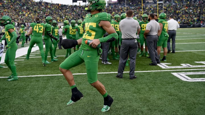 EUGENE, OREGON – NOVEMBER 30: Linebacker Troy Dye #35 of the Oregon Ducks dances during the break between the third and fourth quarter of the game against the Oregon State Beavers at Autzen Stadium on November 30, 2019 in Eugene, Oregon. Oregon won the game 24-10. (Photo by Steve Dykes/Getty Images)
