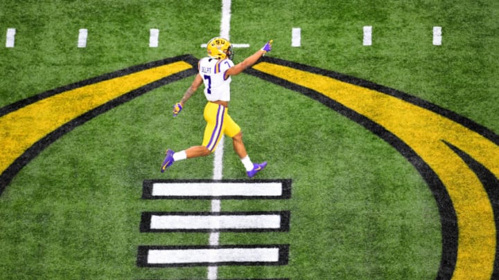 NEW ORLEANS, LA - JANUARY 13: Grant Delpit #7 of the LSU Tigers celebrates a defensive stop against the Clemson Tigers during the College Football Playoff National Championship held at the Mercedes-Benz Superdome on January 13, 2020 in New Orleans, Louisiana. (Photo by Jamie Schwaberow/Getty Images)