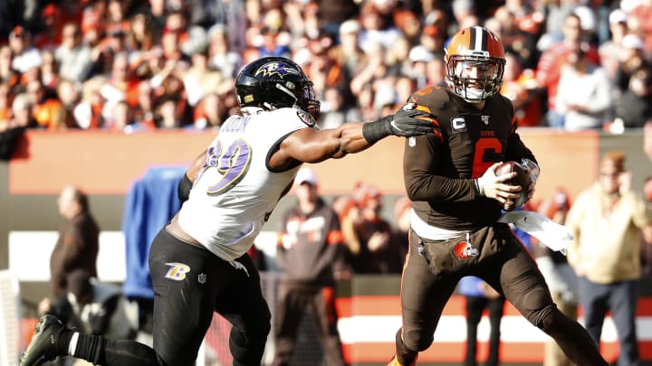 CLEVELAND, OHIO – DECEMBER 22: Baker Mayfield #6 of the Cleveland Browns scrambles with the ball against Matt Judon #99 of the Baltimore Ravens during the first quarter in the game at FirstEnergy Stadium on December 22, 2019 in Cleveland, Ohio. (Photo by Kirk Irwin/Getty Images)