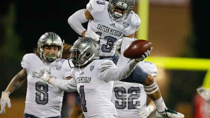 OXFORD, OH – NOVEMBER 15: Kevin McGill #4 of the Eastern Michigan Eagles celebrates with Justin Moody #13 after a interception against the Miami Ohio Redhawks during the second half at Yager Stadium on November 15, 2017 in Oxford, Ohio. (Photo by Michael Reaves/Getty Images)