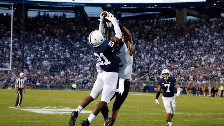 STATE COLLEGE, PA – SEPTEMBER 01: Amani Oruwariye #21 of the Penn State Nittany Lions intercepts a pass in overtime to clinch the win over Corey Sutton #2 of the Appalachian State Mountaineers on September 1, 2018 at Beaver Stadium in State College, Pennsylvania. (Photo by Justin K. Aller/Getty Images)