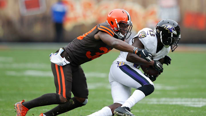 CLEVELAND, OH – OCTOBER 07: T.J. Carrie #38 of the Cleveland Browns tackles John Brown #13 of the Baltimore Ravens in the first half at FirstEnergy Stadium on October 7, 2018 in Cleveland, Ohio. (Photo by Joe Robbins/Getty Images)