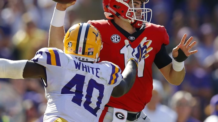 BATON ROUGE, LA – OCTOBER 13: Jake Fromm #11 of the Georgia Bulldogs throws the ball as Devin White #40 of the LSU Tigers defends during the first half at Tiger Stadium on October 13, 2018 in Baton Rouge, Louisiana. (Photo by Jonathan Bachman/Getty Images)