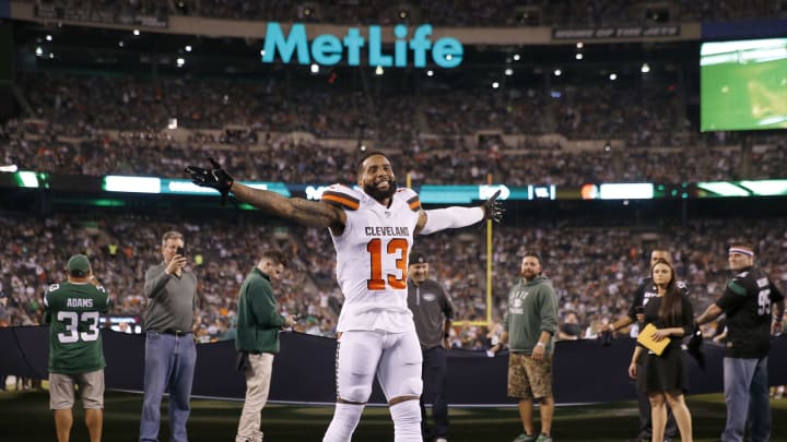 EAST RUTHERFORD, NEW JERSEY – SEPTEMBER 16: Odell Beckham Jr. #13 of the Cleveland Browns reacts to New York Jets fans before the game at MetLife Stadium on September 16, 2019 in East Rutherford, New Jersey. (Photo by Elsa/Getty Images)