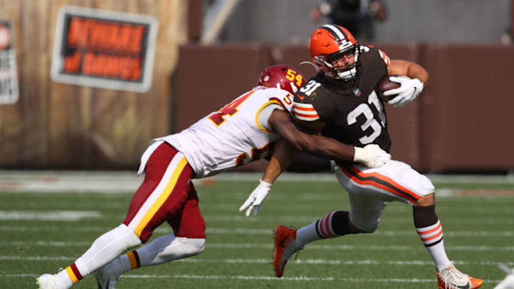 CLEVELAND, OHIO - SEPTEMBER 27: Andy Janovich #31 of the Cleveland Browns tries to escape the tackle of Kevin Pierre-Louis #54 of the Washington Football Team at FirstEnergy Stadium on September 27, 2020 in Cleveland, Ohio. Cleveland won the game 34-20. (Photo by Gregory Shamus/Getty Images)