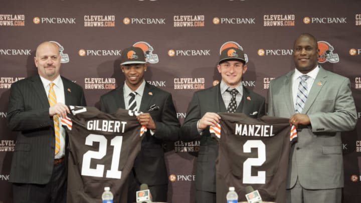 BEREA, OH - MAY 9: Cleveland Browns draft picks Justin Gilbert #21 and Johnny Manziel #2 are introduced by general manager Ray Farmer (L) and head coach Mike Pettine (R) during a press conference at the Browns training facility on May 9, 2014 in Cleveland, Ohio. Gilbert and Manziel were selected 8th and 22nd, respectively, in the first round. (Photo by Jason Miller/Getty Images)
