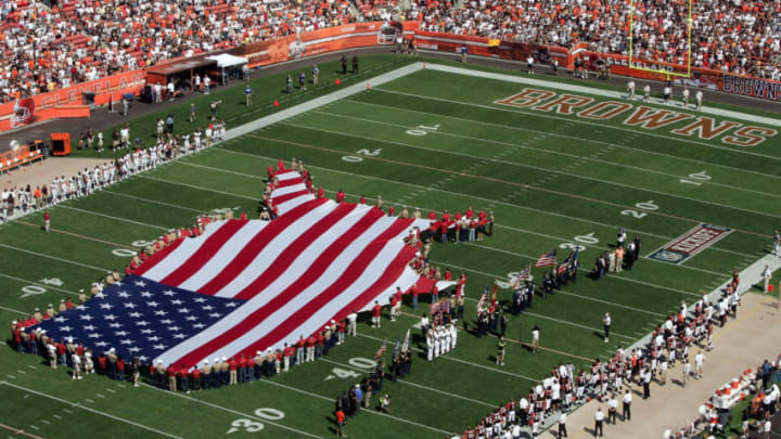 CLEVELAND - SEPTEMBER 11: A flag is unveiled in tribute to the victims of 9/11 and Hurricane Katrina before the opening game between the Cleveland Browns and the Cincinnati Bengals during the first quarter at Cleveland Browns Stadium on September 11, 2005 in Cleveland, Ohio. (Photo by Harry How/Getty Images)