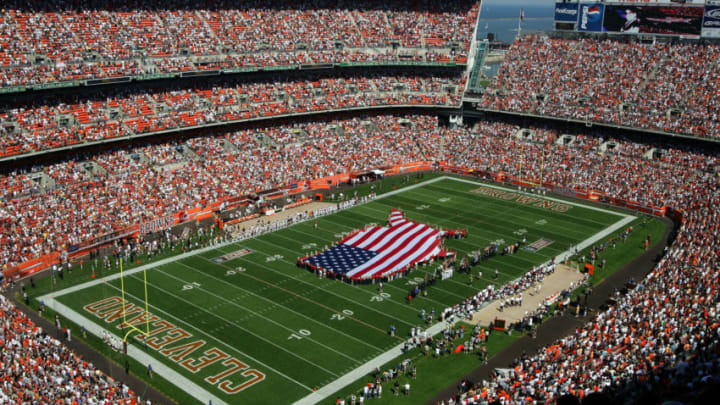 CLEVELAND - SEPTEMBER 11: A flag in the shape of the US is unveiled in tribute to the victims of 9/11and Hurricane Katrina before the game between the Cleveland Browns and the Cincinnati Bengals during the first quarter at Cleveland Browns Stadium on September 11, 2005 in Cleveland, Ohio. (Photo by Harry How/Getty Images)
