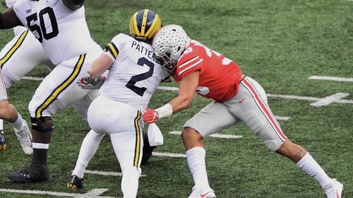 COLUMBUS, OH – NOVEMBER 24: Malik Harrison #39 of the Ohio State Buckeyes tackles Shea Patterson #2 of the Michigan Wolverines at Ohio Stadium on November 24, 2018 in Columbus, Ohio. Ohio State defeated Michigan 62-39. (Photo by Jamie Sabau/Getty Images)