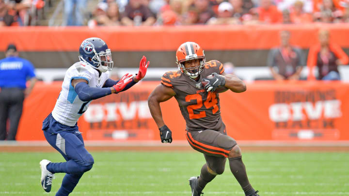 CLEVELAND, OHIO – SEPTEMBER 08: Running back Nick Chubb #24 of the Cleveland Browns rushes down field while under pressure from cornerback Malcolm Butler #21 of the Tennessee Titans during the second half at FirstEnergy Stadium on September 08, 2019 in Cleveland, Ohio. The Titans defeated the Browns 43-13. (Photo by Jason Miller/Getty Images)