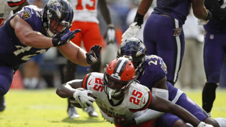BALTIMORE, MARYLAND – SEPTEMBER 29: Running Back Dontrell Hilliard #25 of the Cleveland Browns is tackled by strong safety Tony Jefferson #23 of the Baltimore Ravens in the second half at M&T Bank Stadium on September 29, 2019 in Baltimore, Maryland. (Photo by Todd Olszewski/Getty Images)
