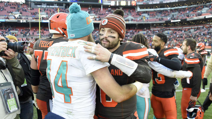 CLEVELAND, OHIO – NOVEMBER 24: Quarterback Ryan Fitzpatrick #14 of the Miami Dolphins congratulates quarterback Baker Mayfield #6 of the Cleveland Browns after the game at FirstEnergy Stadium on November 24, 2019 in Cleveland, Ohio. The Browns defeated the Dolphins 41-24. (Photo by Jason Miller/Getty Images)