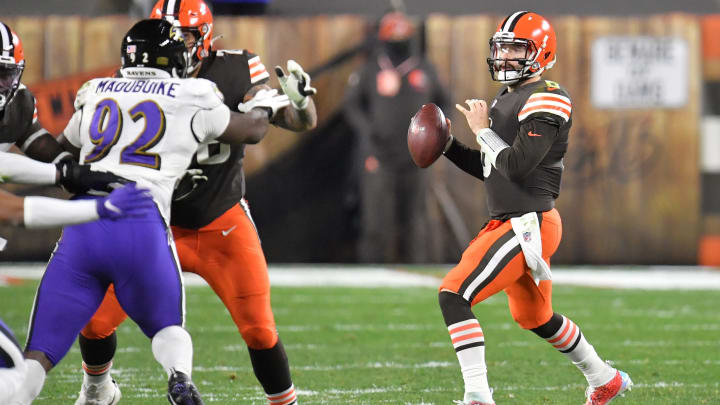 CLEVELAND, OHIO – DECEMBER 14: Quarterback Baker Mayfield #6 of the Cleveland Browns looks for a receiver during the first half against the Baltimore Ravens at FirstEnergy Stadium on December 14, 2020 in Cleveland, Ohio. (Photo by Jason Miller/Getty Images)