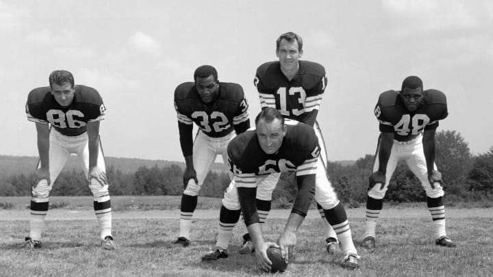 HIRAM, OH – JULY, 1964: (L to R) End Gary Collins #86, runningback Jim Brown #32, quarterback Frank Ryan #13, center John Morrow #56 and runningback Ernie Green #48, of the Cleveland Browns, pose for a group portrait during training camp in July, 1964 at Hiram College in Hiram, Ohio. (Photo by: Henry Barr Collection/Diamond Images/Getty Images)